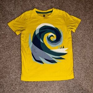 TEA SIZE 7 unisex t-shirt in yellow with blue-green wave design.